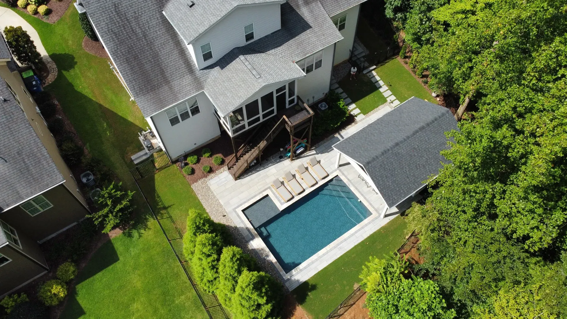 Custom pool and outdoor living space by NOAT
